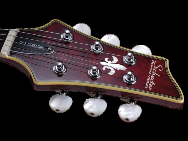 The perloid tuner buttons add a touch of class to the Custom.