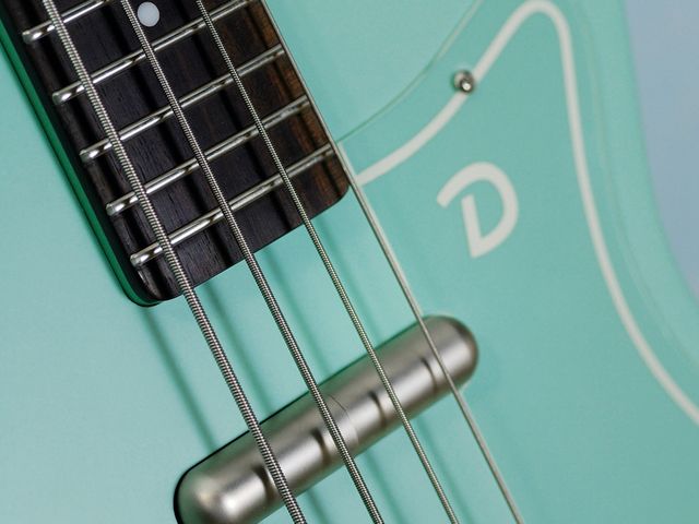 The hardware on the bass is brushed nickel.