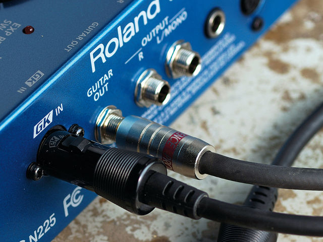 GR-55 The Guitar Out means that you can use separate amps for the guitar and synth sounds.