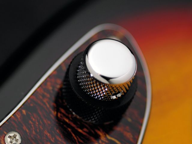 The Jag's chrome knob controls volume.