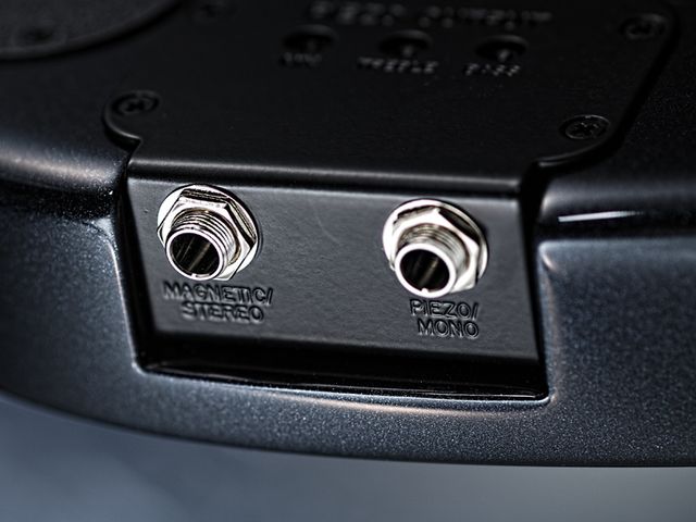 Music Man JPXI Dual outputs enable you to route the piezo and magnetic pickups separately.