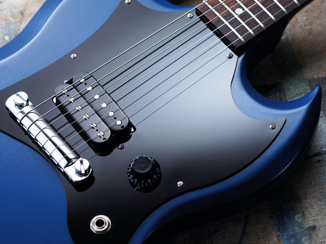 Gibson Melody Maker SG The guitar's grain is visible through its paintwork.