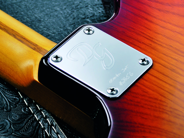 The four-bolt neck and chrome plate are very Fender-inspired.