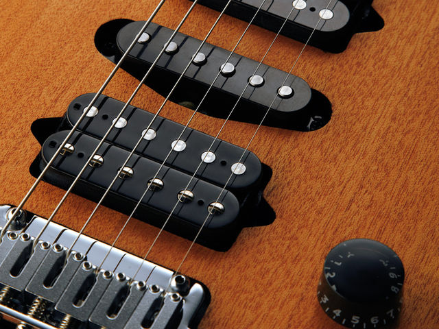 Rasmus Guthrie Govan The Suhr-made pickups are screwed directly into the mahogany body.