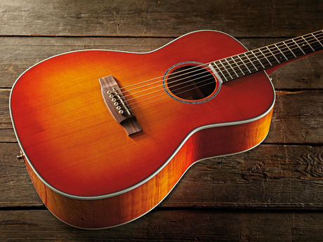 Takamine's New Yorker body style inspired by Martin's 00 design of the 
