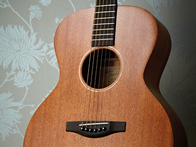 The Atkin AA AM Special's narrow pearl soundhole ring tops off a subtle aesthetic approach.