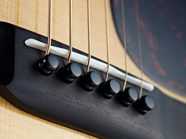 The D-18 comes finished with all-black bridge pins.