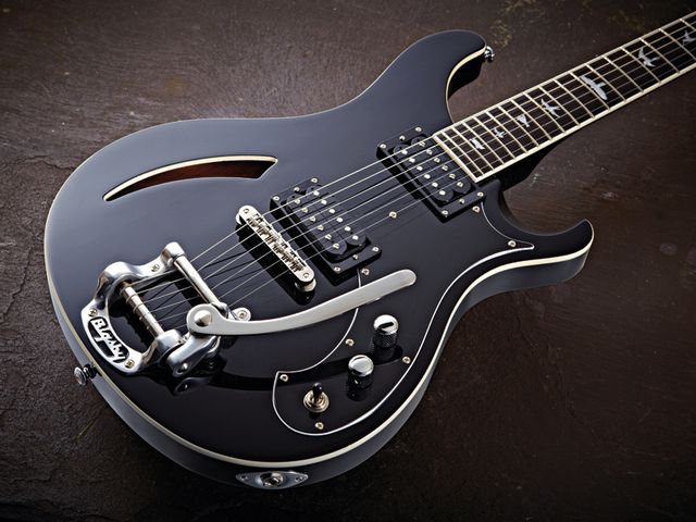 The PRS Custom Semi-Hollow features a Rickenbacker-style soundhole in its maple top.
