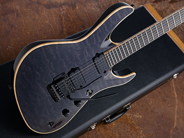 You'll have to be strong to heft the mahogany/maple body of the Jackson Chris Broderick Soloist 6.