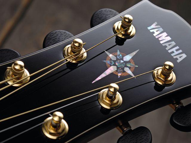 Yamaha CPX1200II Die-cast enclosed ebony tuners and a tasteful motif adorn the CPX's headstock.