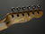 The simple, uncluttered headstock