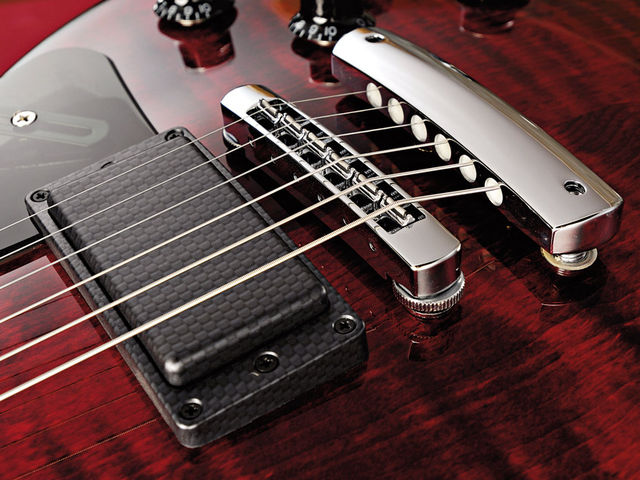 Gibson Dark Fire Carbon-like covers, new hardware and the red finish hammer home the modern vibe
