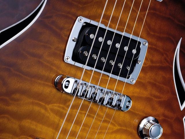 Taylor T3 The bridge has roller saddles to help tuning stability with the Bigsby vibrato