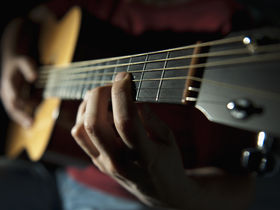 Playing acoustic guitar: fingerstyle
