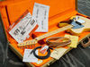 Includes vintage '52 Tele strap, cable and cloth; vintage wiring kit, '50s Tele information kit, bridge cover, owner's manual, saddle height wrench