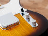 Solid steel "barrel" bridge saddles "Top-hat" switch tip and flat-top knurled aluminum chrome control knobs