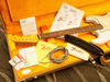 Includes vintage '59 Strat strap, cable and cloth; vintage wiring kit, '50s Strat information kit, bridge cover, owner's manual, saddle height wrench