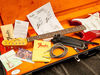 Includes vintage '65 Strat strap, cable and cloth; vintage wiring kit, '60s Strat information kit, bridge cover, owner's manual, saddle height wrench