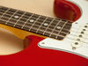 Thick C-shaped maple neck with round-laminated rosewood fingerboard and larger pearl dot inlays