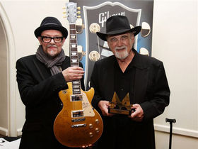 Mojo auctions off signed Les Paul for War Child