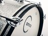 Claws and beautifully sculpted 'timpani' handle tension rods on the bass drum.