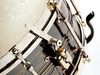 Black Beauty Artist model snare has 'Three Point' strainer with elongated lever for flicking off the snares with your stick.