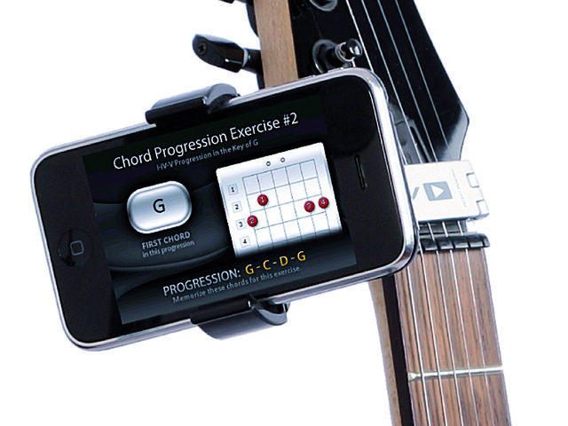 Castiv's Guitar Sidekick locks handily to the strings at your instrument's headstock.
