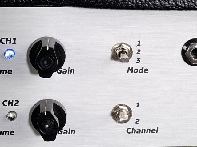 The brushed-metal front panel gives the amp an industrial vibe