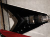 Solid mahogany body, set mahogany neck; Mustaine profile; ebony fingerboard with pearl shark tooth inlays; 25.5" scale; 2 x Mustaine Duncan LiveWire pickups; 2 x volume, tone, 3-way pickup selector; black hardware; classic black or silver finish