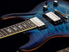 Mahogany body, quilted maple top and back; maple thru-neck; rosewood fingerboard; 24 frets; 25.5" scale; 2 x humbuckers; volume, tone, 3-way pickup selector; nickel hardware; tiger eye, trans amber, trans red, trans blue or scary cherry finish