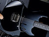 Soft maple body; hard rock maple neck; ebony fingerboard with dot inlays; 22 medium frets; 25.5" scale; Custom Alnico V humbucker; volume control; black hardware; black or ivory finish