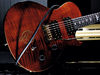 Mahogany body with flamed maple veneer; set maple neck; ebony fingerboard with 'Bird' inlays; 24 jumbo frets; 25" scale; PRS SE HFS, Treble (B), SE Vintage Bass (N) humbuckers; volume, tone, 3-way pickup selector; gold hardware; Tortoise Shell finish