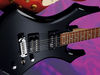 Agathis body; maple bolt-on neck; rosewood fingerboard; 25.5" scale; 2 x BDSM humbuckers at neck and bridge; volume, tone and 3-way pickup selector; chrome tuners and wraparound bridge; black or white finish