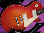 Basswood body, wuton top; hard maple bolt-on neck; Indonesian rosewood fingerboard; 24.75' scale; 2 x Guitar Tech humbuckers; 2 x volume, 2 x tone, 3-way pickup selector; Guitar Tech tune-o-matic bridge, stop tailpiece; cherry sunburst or gloss black finish