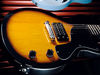 Alder body; mahogany neck; rosewood fingerboard; 24.75" scale; Epiphone humbucker; volume and tone controls; chrome combined bridge/tailpiece; vintage sunburst or black finish