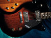 Solid mahogany body; bolt-on maple neck; Rosewood fingerboard, dot inlays; 24.6" scale; 2 x Gretsch mini-humbucking pickups; volume, tone, 3-position toggle; chrome hardware; tobacco sunburst or black transparent finish