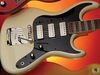 Solid basswood body; bolt-on maple neck; rosewood fingerboard, 'stripe' inlays; 22 frets; 25.5" scale; 3 x Höfner 'staple' humbuckers; volume, tone, on/off switches, 3 x pickup selector; nickel hardware; cream or red finish