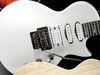 Solid mahogany body; set mahogany neck; ebony fingerboard; 24 frets; 25.5" scale; 2 x single-coils, humbucker; volume, 2 x tone, 5-way pickup selector; black nickel hardware; pearl white or candy red finish