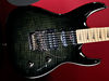Solid mahogany body; bolt-on maple neck; maple fingerboard; 24 frets; 25.5" scale; HSS pickups configuration; volume, tone, 3-way pickup selector; black nickel hardware; Trans Black, Fireburst or Purple finish
