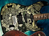 Basswood body; C-Shape maple neck; rosewood fingerboard; 25.5" scale; Duncan Designed HB102B humbucker, 2 x alnico single-coils; volume, 2 x tone, 5-way toggle switch; rustic and worn hardware; Obey Dissent Graphic finish