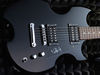 Solid select wood body; bolt-on mahogany neck; rosewood fingerboard, dot inlays; 24" scale; 2 x Washburn humbuckers; volume, tone, 3-way pickup selector; chrome hardware; tuners, Tune-o-matic bridge, stop bar; black finish