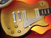 Solid mahogany body; set mahogany neck; rosewood fingerboard with block inlays; 22 frets; 24.75" scale; 2 x Duncan-Designed P-90 single-coils; 2 x volume, 2 x tone, 3-way pickup selector; chrome hardware; gold finish