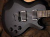 Solid mahogany body; bolt-on maple neck; rosewood fingerboard with pentagon inlays; 24" scale; 2 x EMG-HZ H4 humbuckers (neck and bridge); 2 x volume, tone, 3-way pickup selector; die-cast tuners, TonePros locking bridge, string-thru tailpiece; black satin finish