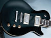 Nato body; set mahogany neck; rosewood fingerboard; 22 frets; 24.75" scale; 2 x Hamer humbuckers; 2 x volume, tone, 3-way pickup selector; die-cast hardware; Black finish