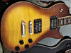 Mahogany body with maple cap; mahogany neck; rosewood fingerboard; 22 frets; 24.75" scale; 2 x Duncan USM humbuckers; 2 x volume, 2 x tone; chrome hardware; Tobacco Sunburst or Red finish