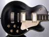 Mahogany body with carved maple top; set mahogany neck with pearl block inlays; resonator fretboard; 2 x Hagstrom Custom '58 humbuckers; 25.5" scale; chrome hardware; 2 x volume, 2 x tone, 3-way pickup selector, coil tap switch; black or vintage sunburst finish