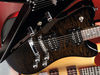 Solid nato body; bolt-on maple neck; rosewood fingerboard; 22 frets; 24.75" scale; 2 x Duncan-designed HB-101 pickups; 2 x volume, 2 x tone, 3-way pickup selector; chrome hardware; transparent or black finish