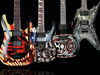 From L-R: Schecter C-1 Propaganda, Jackson DK2T Skulls, Washburn SI-61 and Dean Razorback Cemetery Gates