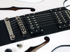 Adam Black HS Centre verdict £219; Laminated maple body with solid centre block; set maple neck; ebony fingerboard with 12th fret dot inlay; 24.75" scale; 2x open-coil ASBO humbuckers; 2 x volume, 2 x tone; black hardware; white/black/white or black/white/black finish