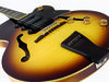 Peerless Wizard verdict £399; Laminated flame maple body; set maple neck; rosewood fingerboard with mother-of-pearl inlays; 25.5" scale; 3x dog ear P90s (humbuckers also available); 3 x volume, tone; chrome finish; vintage sunburst or violin high gloss finish